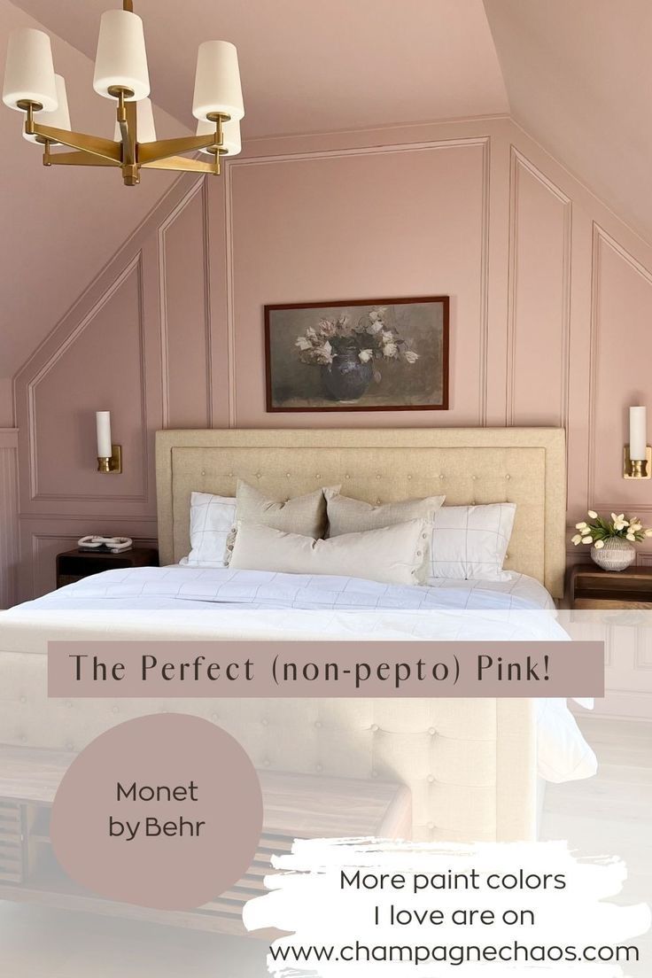 a bedroom with pink walls and white bedding in the center is a chandelier