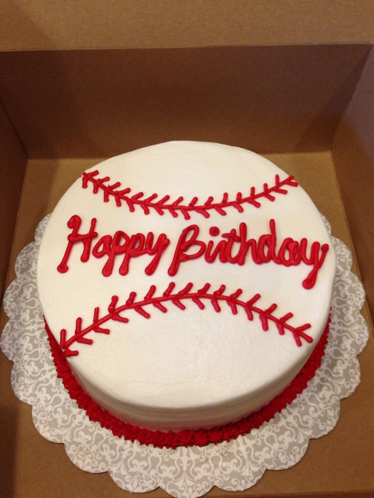 a birthday cake in a box with the word happy birthday written on it and a baseball design