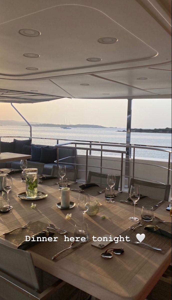 the dining table is set for two on the boat