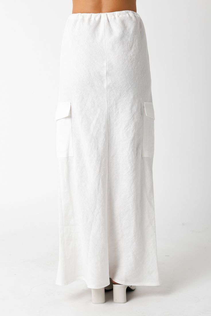 The Kaia White Linen Cargo Maxi Skirt is the perfect vacation cover-up! White linen woven fabric shapes this cargo maxi skirt with a mid-rise fit and drawstring tie. Style with sandals and a cute top and wear to dinner! DETAILS & FIT Loose Fit. 100% Linen. Machine wash cold. Imported. Linen Maxi Skirt, Boho Pink, Maxi Skirt Boho, Low Waisted, White Linen, Cute Tops, Woven Fabric, Maxi Skirt, Mid Rise