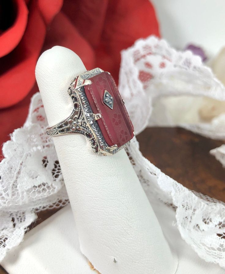 Antique Collectible Diamond Ring With Gemstone, Antique Ruby Ring With Filigree For Anniversary, Antique Ruby Ring For Formal Occasions, Vintage Silver Octagon Ring, Vintage Octagon Gemstone Ring, Antique Engraved Ruby Ring For Anniversary, Vintage Ruby Ring With Accent Stones For Anniversary, Antique Emerald Cut Collectible Rings, Victorian Filigree Ring With Rose Cut Diamonds