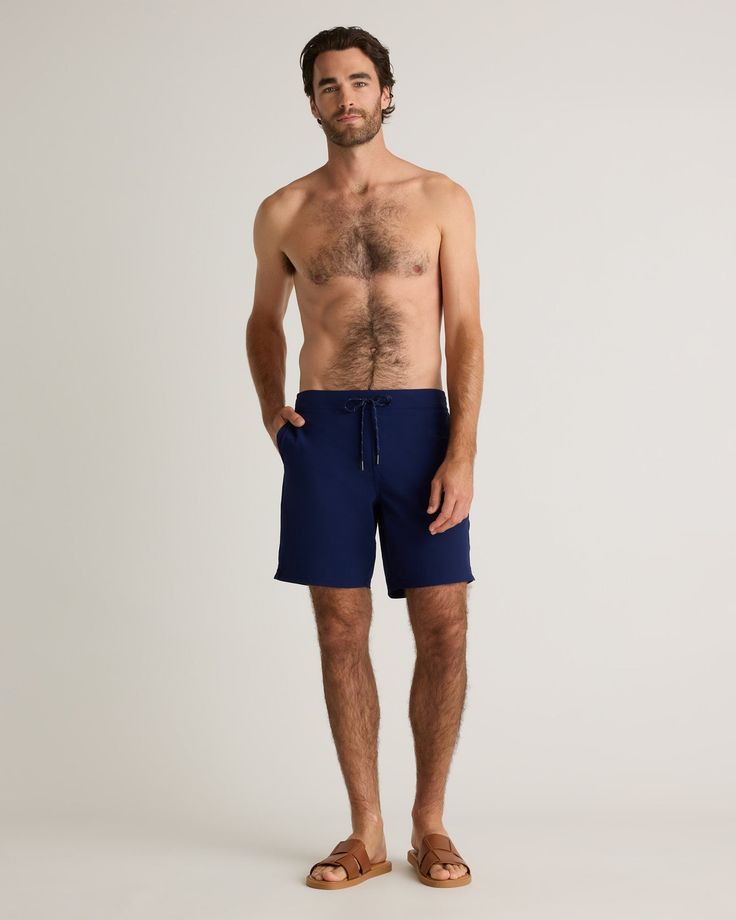 Our Italian Boardshort is the ultimate summer essential for the active man. Made from quick-drying, sun screen and oil resistant material, this swim trunk offers UPF50 protection for all-day wear. The Italian fabrication ensures durability, resisting fading, pilling, and snagging for long-lasting use. Whether you're hitting the beach, pool, or backyard BBQ, this short-lined swim trunk will keep you looking and feeling your best. Functional Swimwear With Built-in Shorts For Swimming, Sporty Navy Swimwear With Built-in Shorts, Summer Athleisure Boxer Briefs With Built-in Shorts, Functional Summer Shorts, Solid Color Moisture-wicking Relaxed Fit Swim Trunks, Sporty Navy Swimwear For Pool, Sporty Navy Swimwear For The Pool, Functional Relaxed Fit Short Swim Trunks, Functional Short Swim Trunks With Relaxed Fit