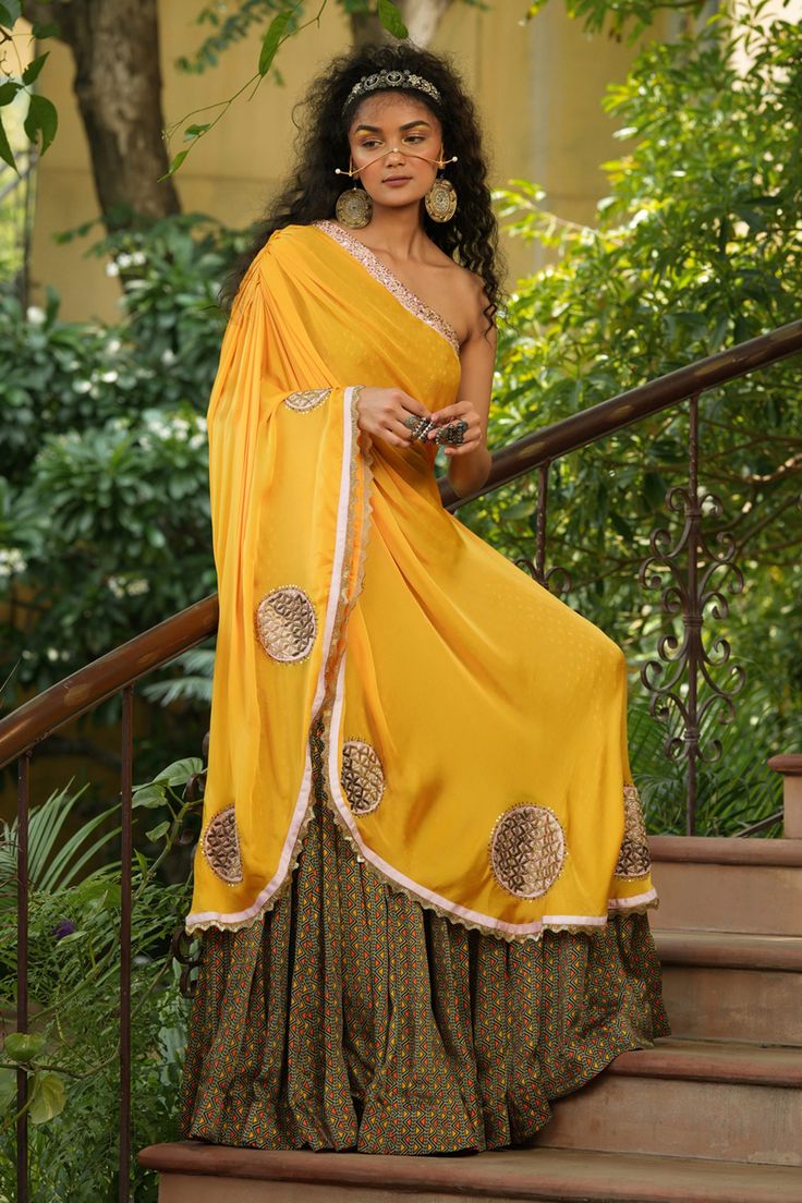 Sunrise yellow one shoulder gown with sage green geometric printed layer and embroidered in applique, cutdana and resham work on top.
Components:1
Pattern:Print and Embroidery
Type of Work:Geometric Print, Applique, Cutdana and Resham
Neckline:One Shoulder
Fabric:Silk Satin
Color:Yellow,Green
Other Details:
Cutwork detail border
Draping on the shoulder
Note: Only selling the product mentioned in the description from the video.
Occasion:Destination Wedding - Aza Fashions Gown Yellow, Embroidery Geometric, Resham Work, Gown For Women, Yellow Silk, One Shoulder Gown, Gowns Online, Satin Color, Fabric Silk