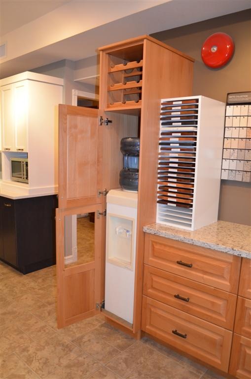 a kitchen with wooden cabinets and white appliances