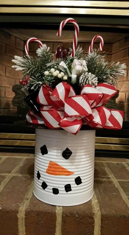 a decorated bucket with candy canes and christmas decorations