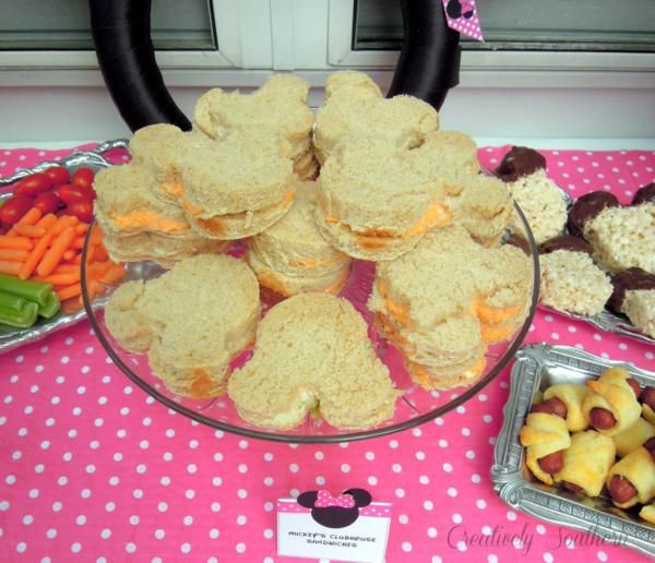 a table topped with lots of different types of food and desserts next to each other