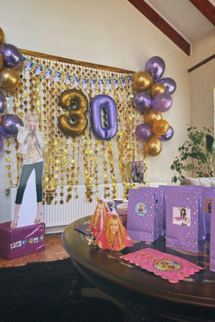 a room with balloons and decorations on the wall for an 80th birthday party or celebration