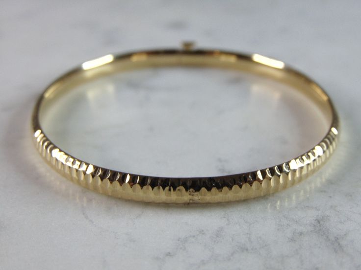 "A WOMENS VINTAGE ESTATE 14K YELLOW GOLD BANGLE BRACELET. THE TOTAL WEIGHT IS 6g, AND HAS AN INNER CIRCUMFERENCE 0F 7\" AND IS 1/4\" WIDE. ANY QUESTIONS PLEASE DONT HESITATE TO ASK. BE SURE TO CHECK OUT SOME OF OUR OTHER GREAT ITEMS UP FOR SALE. THANK YOU. IF THERE ARE ANY ISSUES PLEASE CONTACT US, WE'RE ALWAYS HAPPY TO TRY TO HELP YOU OUT AS BEST AS WE CAN." Vintage Yellow Gold Bangle Stamped 14k, Vintage 14k Stamped Yellow Gold Bangle, Antique Yellow Gold Hallmarked Bangle, Antique Hallmarked Yellow Gold Bangle, Antique Round 14k Gold Bangle, Antique 14k Gold Round Bangle, Heirloom 14k Gold Round Bracelets, Heirloom 14k Gold Bracelets, Heirloom 14k Gold Round Bracelet