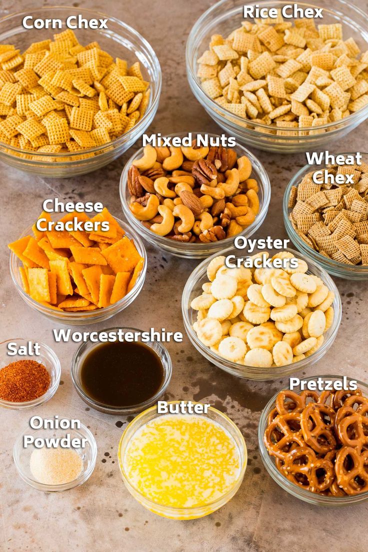 the ingredients to make cheesy snack mix in bowls