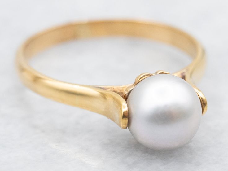 Stack this lovely grey pearl solitaire with other bands and solitaires or let it shine alone, in all its romantic glory! Here's a beautiful, soft grey pearl carefully set in a vintage 18-karat yellow gold Tiffany and Company mounting, a classic statement piece! Metal: 18K Yellow GoldGem: Grey PearlGem Measurements: 6.4 mm, RoundRing Size: 5.50 Tiffany Co Rings, Gold Tiffany, Lovely Grey, Let It Shine, Accessories Gold, Pearl Grey, Tiffany & Co., Statement Pieces, Jewelry Accessories