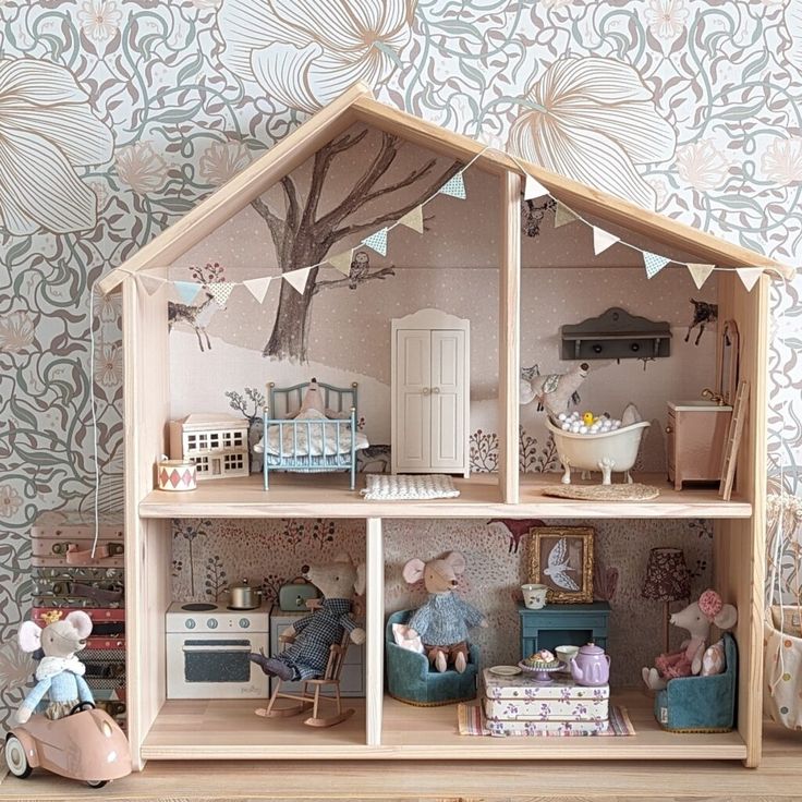 a doll house with furniture and decorations on the shelf in front of wallpapered walls