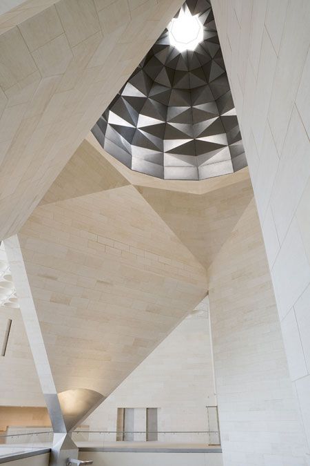 the inside of a building with a skylight in it's center and stairs leading up to the ceiling