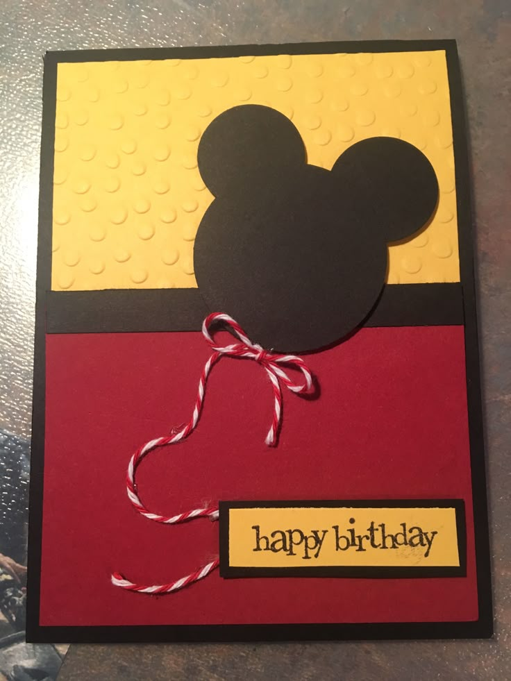 a mickey mouse birthday card on a table