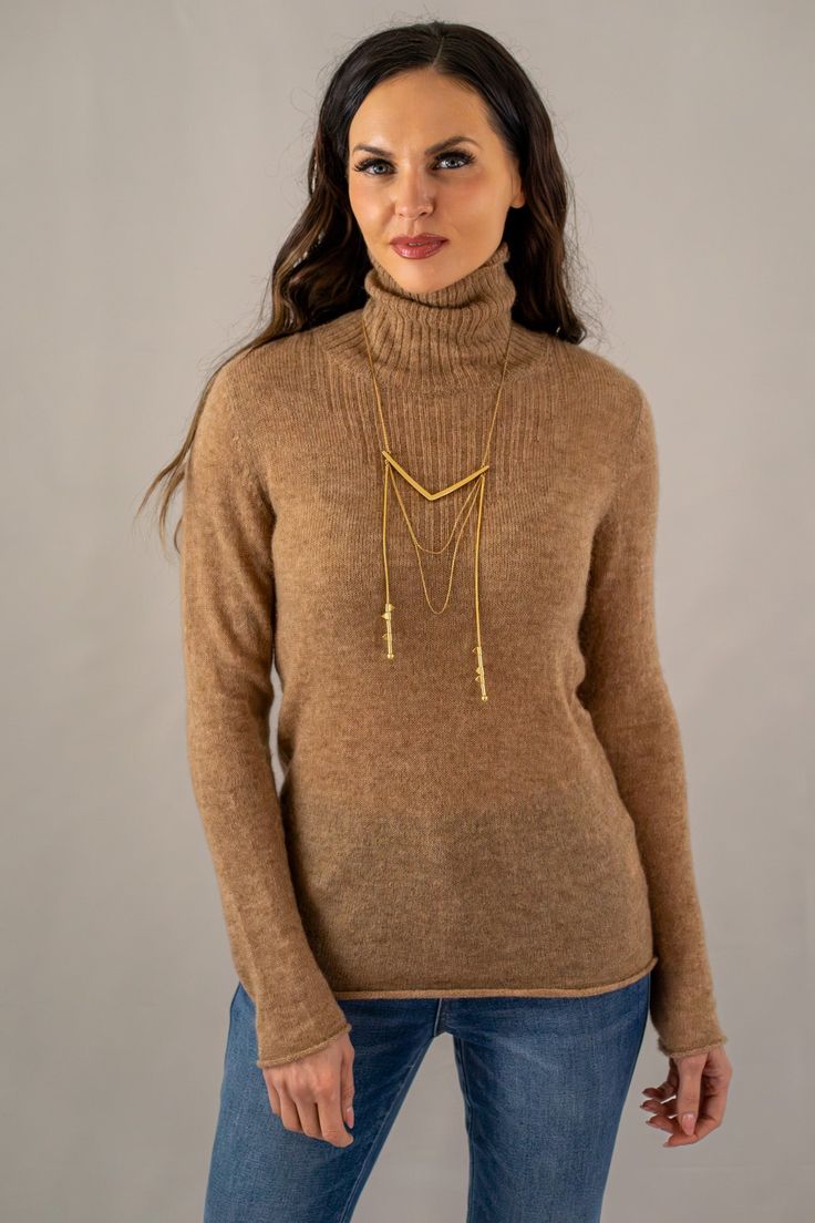 Elevate your cold-weather collection with our slim fit heathered turtleneck sweater, a harmonious blend of comfort and style. This camel textured knit top features subtle color flecks, adding depth to the classic design. With its sophisticated high neckline and versatile appeal, this sweater is an essential piece for layering or as a standalone statement. 

60% Baby Alpaca
5% Merino Wool
35% Polyamide
Made in Peru

DRY CLEAN Elegant Cable Knit Turtleneck For Fall, Knit Turtleneck For Layering, Elegant Textured Knit Turtleneck For Fall, Textured Knit Turtleneck For Fall Layering, Versatile Turtleneck For Winter Layering, Classic Knit Turtleneck For Layering, Fine Knit Turtleneck For Fall Layering, Modern Turtleneck For Fall, Fine Knit Beige Turtleneck For Fall