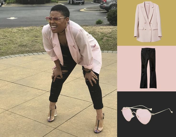 a woman in pink jacket and black pants with sunglasses