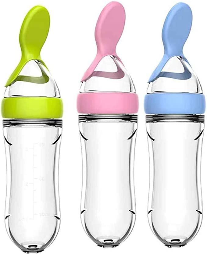 three baby bottles in different colors and sizes