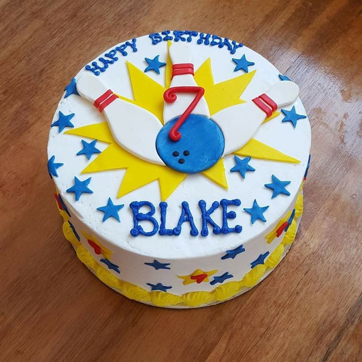 a birthday cake for a boy on a wooden table