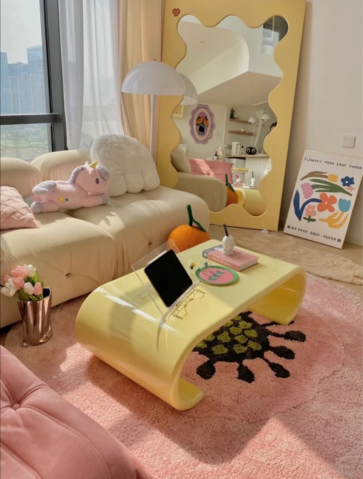 a living room filled with furniture and a pink rug