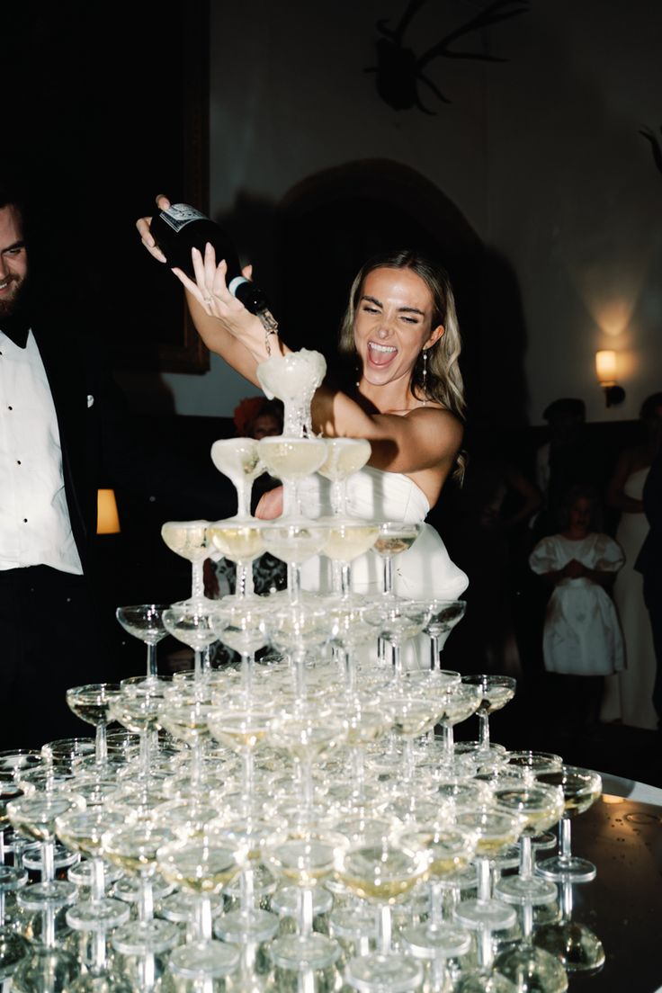 Bride is stood over a tower of champagne glasses and pouring champagne into the glasses: whilst smiling and enjoying her wedding day. Nye Wedding, Dream Wedding Decorations, Champagne Tower, Wedding Money, Future Wedding Plans, Dream Wedding Ideas Dresses, Champagne Wedding, Wedding Goals, Nyc Wedding