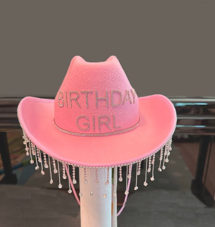 a pink hat with the words birthday girl written on it