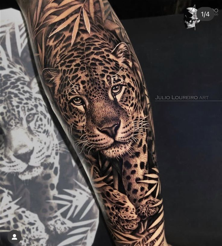 a man's arm with a leopard and tiger tattoo on it