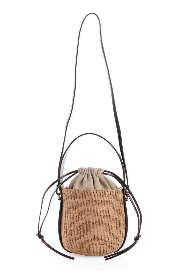 Elevate your warm-weather look with this compact basket bag designed with a drawstring lining and a leather version of the logo-embellished Woody strap. Drawstring closure Top carry handle; crossbody strap Lined Paper straw with leather trim Made in Italy Designer Handbags This brand has B Corp certification, representing business practices with emphasis on social and environmental performance, accountability and transparency This brand meets Nordstrom Responsible Brands criteria: brand adheres Luxury Basket Bag For Everyday, Luxury Basket-shaped Everyday Bag, Chic Leather Bucket Straw Bag, Luxury Summer Straw Bag With Detachable Strap, Luxury Straw Bag With Adjustable Strap For Travel, Luxury Natural Bucket Bag With Removable Pouch, Modern Natural Bucket Bag For Shopping, Modern Natural Color Bucket Bag For Shopping, Luxury Beige Basket Bucket Bag