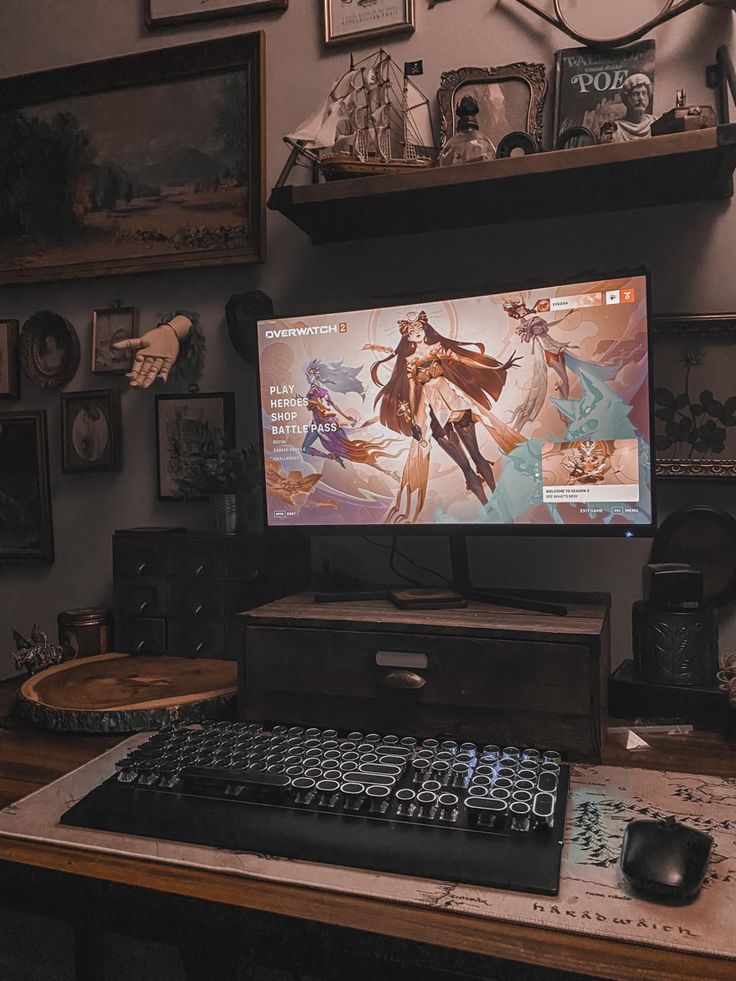 a computer monitor sitting on top of a wooden desk next to a keyboard and mouse