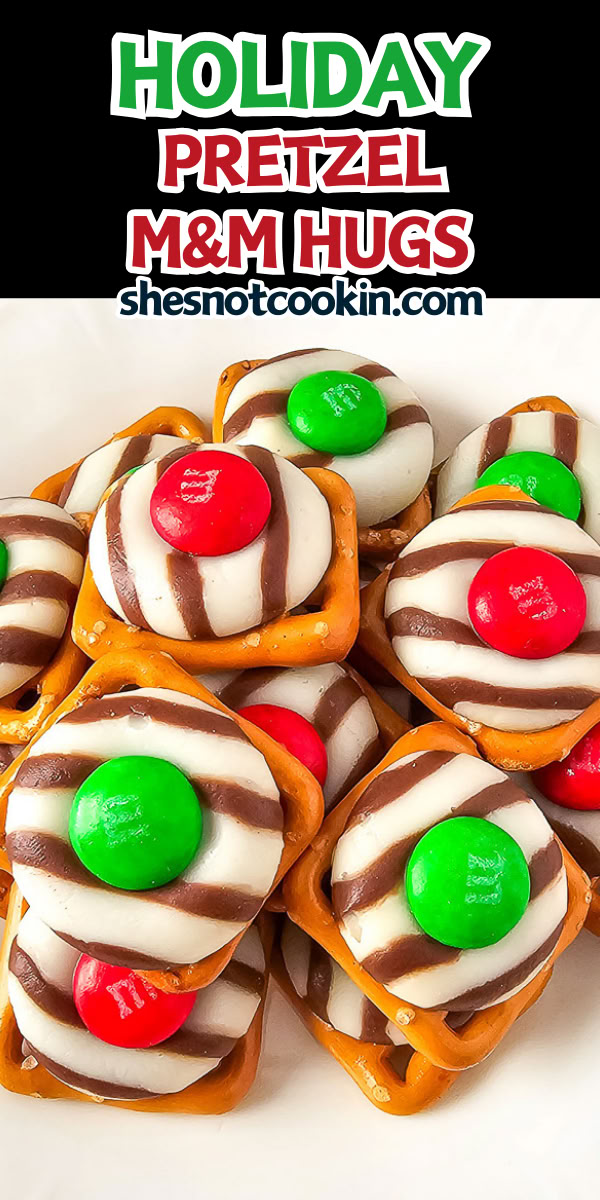 Cute pretzel Christmas hugs on a white plate. Christmas Hugs Pretzels, Class Party Treats Christmas, Pretzel Peppermint Kisses And M&ms, Mini Pretzel Christmas Treats, Hershey Hugs Pretzels, Pretzels Hugs And M&ms, Christmas Snack Foods For Party, Pretzel And Kisses Recipe, Pretzel Hershey Kiss M&m Christmas