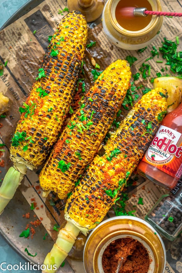 grilled corn on the cob with ketchup, mustard and seasoning