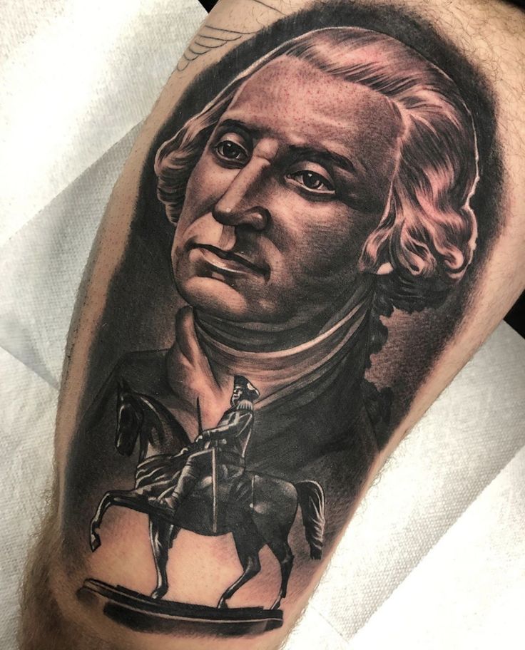 a man's arm with a portrait of thomas washington on it and a horse