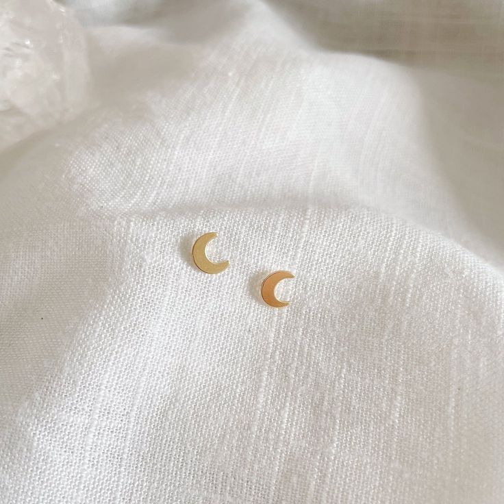 14k gold filled 6mm moon studs Please note that due to the handmade nature of this piece, they will vary slightly in appearance. There may also be slight color variations from soldering where the post meets the earrings, which is totally normal! Sold as a pair and comes with backings Gold filled is a soft metal so when putting the backings on and taking them off, hold the base of the post to avoid any bending Moon Studs, Jewelry Workshop, Swimwear Online, Jewelry Repair, Toe Rings, Soldering, Bending, Personalized Jewelry, Custom Jewelry