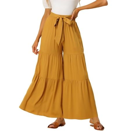 This pants fashioned with a ruffle hem and flowy wide legs,make it more loose and comfortable The flared leg trousers have over sized ruffling and an elastic waist for easy movement.In these sultry yet comfortable wide-leg pants, catch the breeze and plenty of double takes. Flowy wide-leg pants with an elastic waist cinched by an attached tie belt make these pants more distinctive and attention-grabbing.The relaxed fit and butterfly hem make them a great choice for spring and summer closets. Mea Flowy Wide Leg Pants, Athleisure Pants, Wide Leg Palazzo Pants, Womens Wide Leg Pants, Yellow Outfit, Hem Style, Women Pants Casual, Boho Women, Palazzo Pants