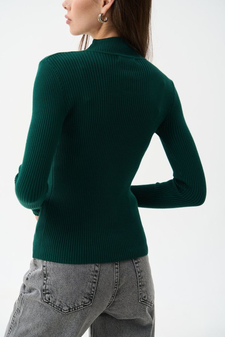 A timeless classic that suits everyone—this ribbed turtleneck with a mock neck is a versatile wardrobe staple. The soft ribbed knit provides warmth and comfort even in cold weather, while beautifully accentuating the silhouette. The mock neck and extended sleeves add a cozy and stylish touch to any outfit. For busy days, pair it with jeans or tailored pieces in neutral shades like black, white, beige, or gray. For special occasions, try combining this turtleneck with a satin skirt—we guarantee y Fall Turtleneck With Ribbed Cuffs, Fall Turtleneck With Ribbed Cuffs And High Neck, Winter Knit Mock Neck Top, Fall Knit Mock Neck Turtleneck Top, Winter Knit High Neck Mock Neck Top, Knit Turtleneck Mock Neck Top For Fall, Fall High Neck Turtleneck With Ribbed Cuffs, Winter High Neck Knit Mock Neck Top, Chic Knit Turtleneck With Ribbed Cuffs