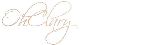 the word oh my written in cursive writing on a white background with gold foil