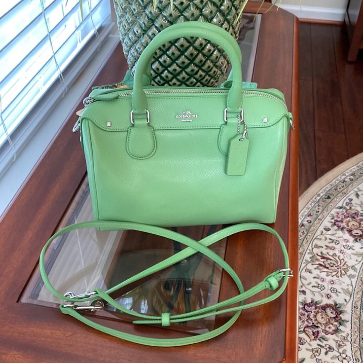 This Bag Is A Beautiful Spring Green Color And Has Absolutely Never Been Used!! 100% Authentic. The Detachable Handle Has A Maximum 26” Drop & Could Also Be Made Shorter. Beautiful Silver Hardware. Can Be Used All Spring & Summer. A Sassy Little Bag For Evening Outings Using The Satchel Handles Or A Cute Little Crossbody When You Are On The Go. The Original Price Is $250. All Offers Will Be Considered. Spring Green Color, Satchel Handbag, How To Make Shorts, Satchel Handbags, Spring Green, Silver Hardware, Kate Spade Top Handle Bag, Coach Bags, Green Color