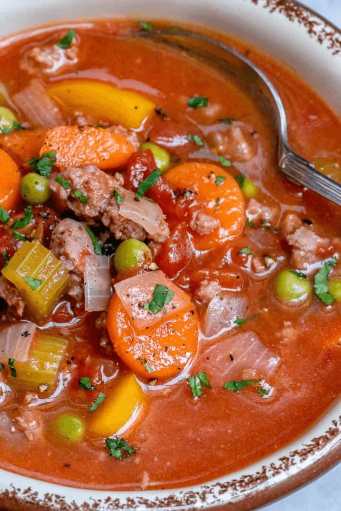 a bowl of soup with meat and vegetables