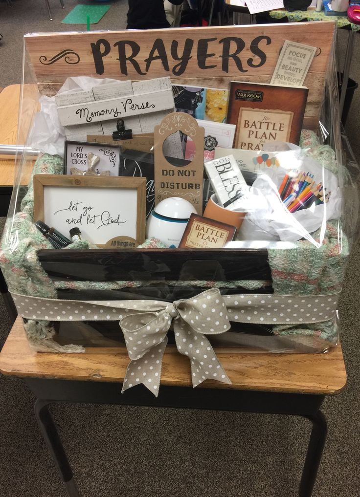 a wooden table topped with lots of different types of crafts and items on top of it