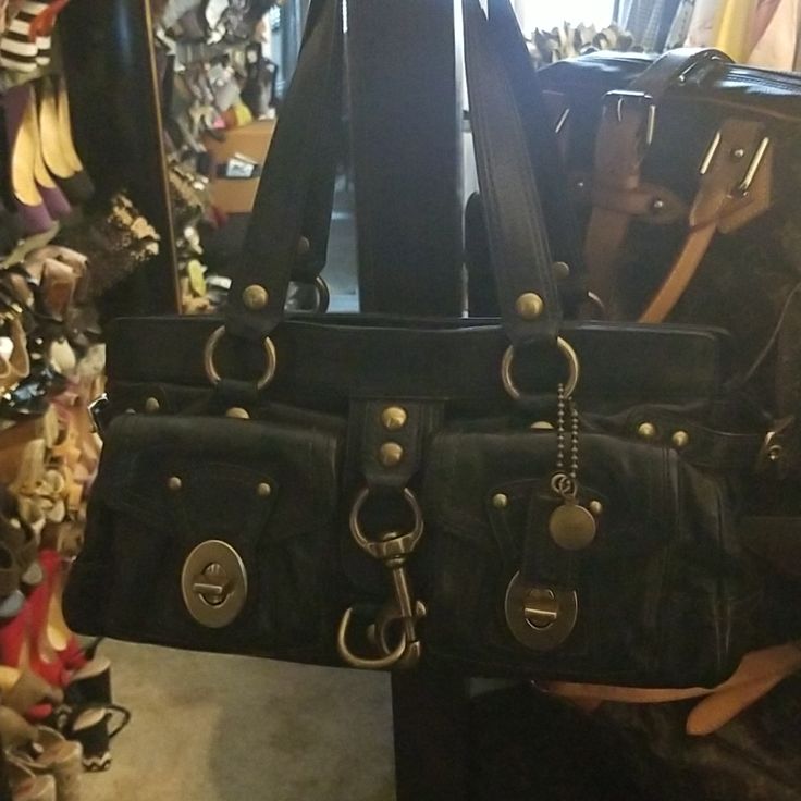 Coach Legacy Limited Edition Handbag All Leather Brass Hardware 2 Front Pockets 2 Interior Pockets 1 Large Interior Pocket W/ Zipper Interior Lining Shows Minimal Use Approximately 15"X10"X6" Very Good Pre-Owned Condition Designer Shoulder Bag With Brass Hardware For Shopping, Coach Shoulder Tote Bag With Metal Hardware, Coach Bags With Metal Hardware For Daily Use, Black Travel Bag With Brass Hardware, Designer Bags With Brass Hardware For Everyday Use, Coach Shoulder Bag With Brass Hardware For Everyday, Designer Coach Bags With Metal Hardware, Designer Tote Shoulder Bag With Brass Hardware, Designer Shoulder Bag Tote With Brass Hardware