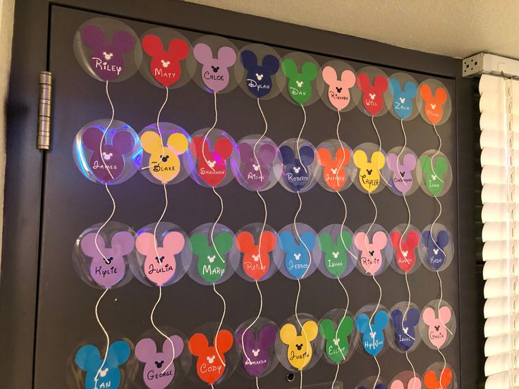 a mickey mouse themed bulletin board with many different colors and designs on it's sides