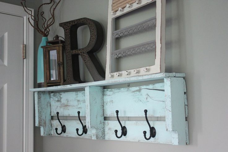 a shelf with hooks and letters on it