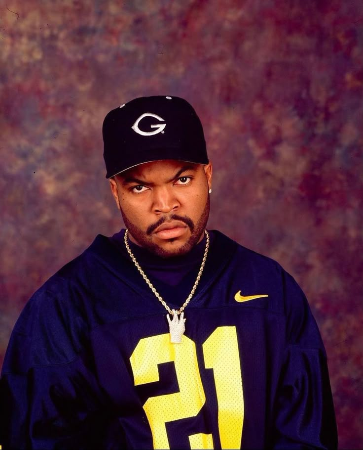 a man in a football uniform posing for a photo