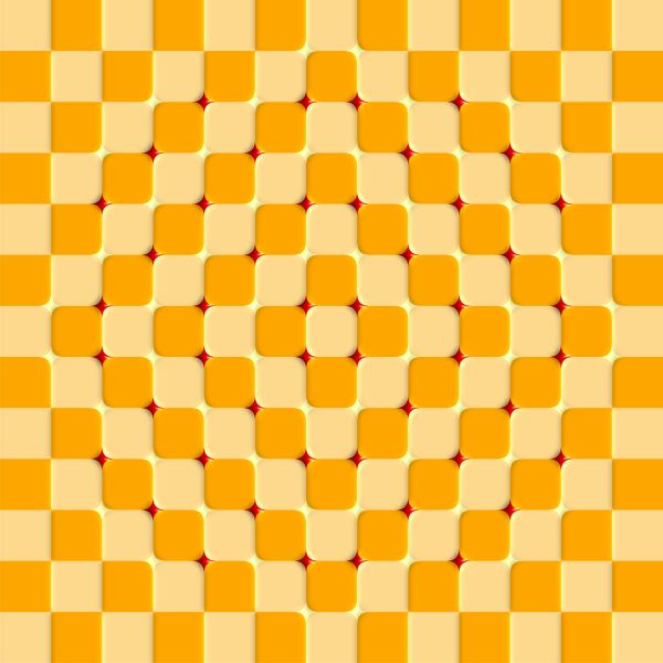 an orange and yellow pattern with red dots