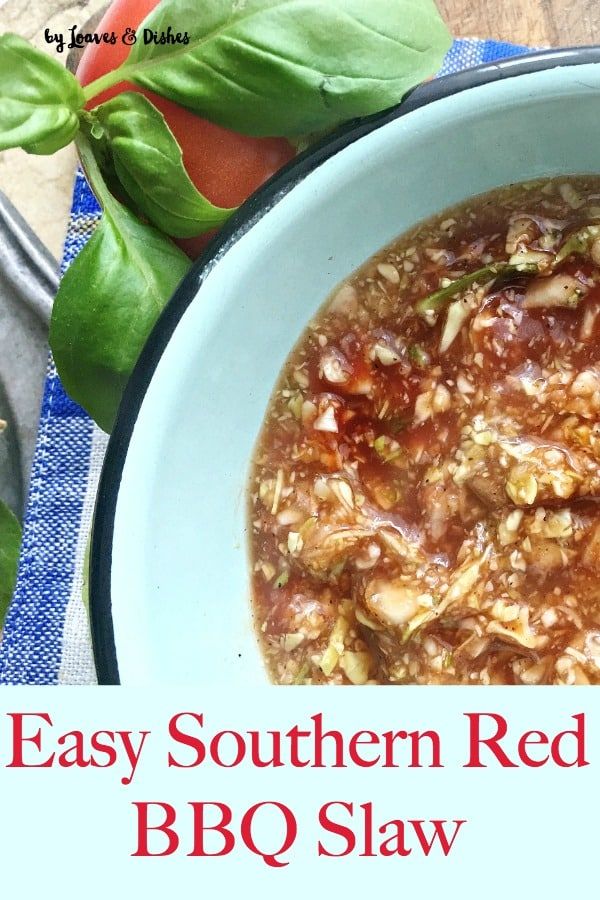 an easy southern red bean bbq stew in a blue bowl with basil on the side