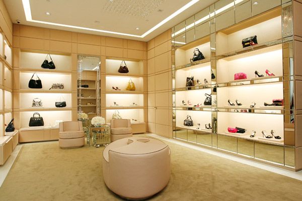 a room filled with lots of shoes and handbags