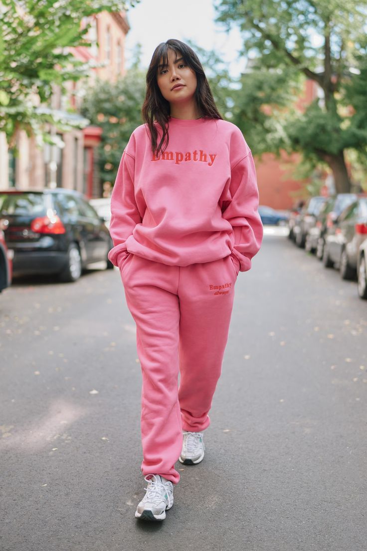 This fleece crewneck has a super cozy feel with an oversized relaxed fit and meant to be worn year-round. Bubblegum pink fleece crewneck 50% Cotton / 50% Polyester 'Empathy' embroidered across chest 'always' embroidered on left wrist Image 1: Model is 56" and is wearing S/M (Wash care instructions) Turn inside out and machine wash color with like colors (Dry care instructions) Hang dry Pink Sweats Outfit, Sweat Suits Outfits, The Mayfair Group, Crewneck Outfit, Sweats Outfit, Sweatpants With Pockets, Puff Paint, Gods Girl, Pink Sweatpants