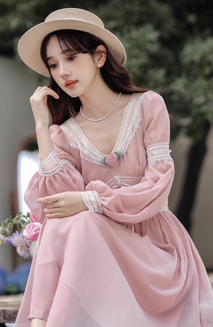 Feel ethereal like a pink fairy in this chiffon dress with a v-neckline, lace inserts, long puff sleeves and swishy midi skirt. Concealed back zipper. Lined. S: 32"-34" chest, 24"-26" waist, 45" lengthM: 33.5"-35.5" chest, 25.5"-27.5" waist, 45" lengthL: 35"-37" chest, 27"-29" waist, 45" length Elegant Pink Midi Dress With Lace Patchwork, Spring Midi Dress With Lace Puff Sleeves, Feminine Pink Chiffon Dress With Long Sleeves, Pink Long Sleeve Feminine Chiffon Dress, Feminine Pink Long Sleeve Chiffon Dress, Spring V-neck Dress With Lace Cuffs, Feminine Long Sleeve Pink Chiffon Dress, V-neck Dress With Lace Cuffs, Pink Chiffon Long Sleeve Midi Dress