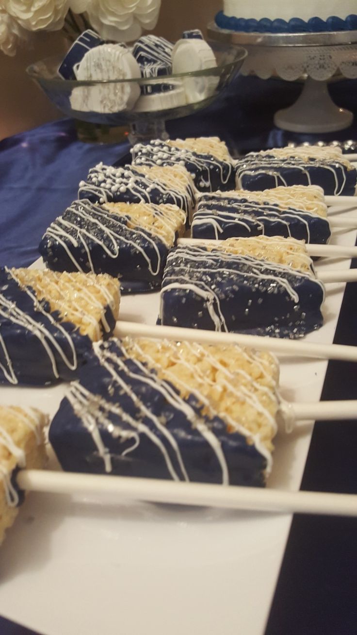 several blue and white desserts sitting on top of a table