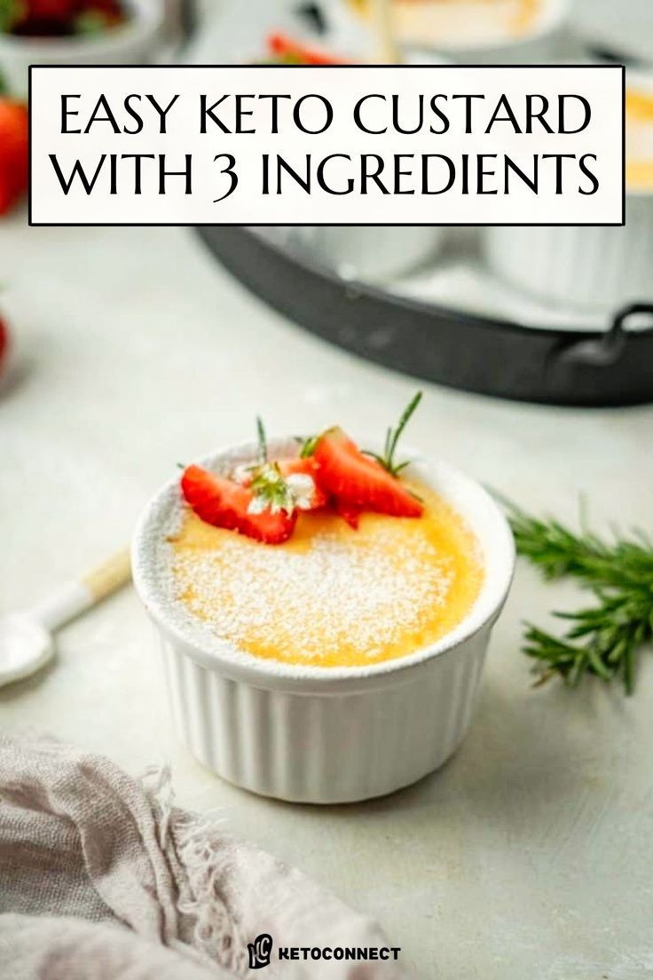 a small bowl filled with pudding and topped with strawberries, on top of a table