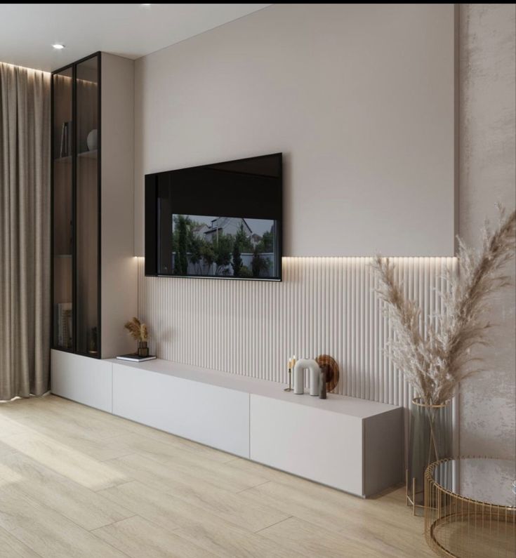 a television is mounted on the wall in a modern living room with wood flooring