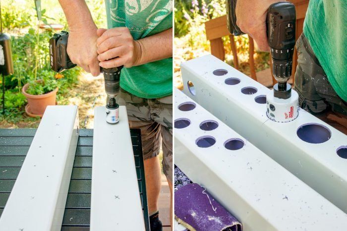 a man is using a drill to make holes in the side of a piece of wood